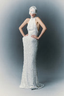 White Plan Atalia gown with elegant flowing fabric and intricate detailing, perfect for formal occasions.