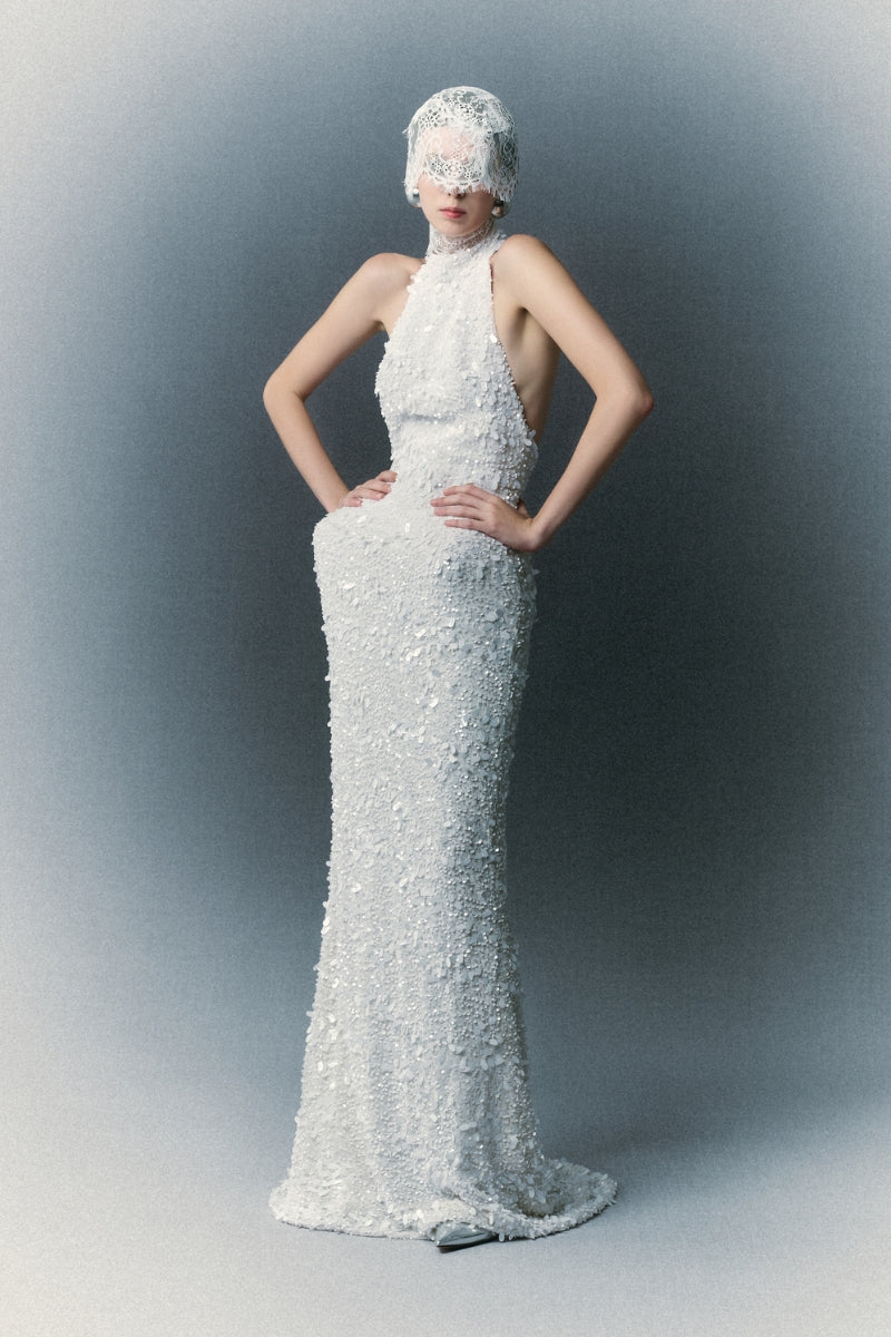 White Plan Atalia gown with elegant flowing fabric and intricate detailing, perfect for formal occasions.