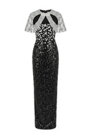 HACCHIC COUTURE Luna Crystal Cape Gown in black and silver with intricate crystal embellishments and flowing fabric.