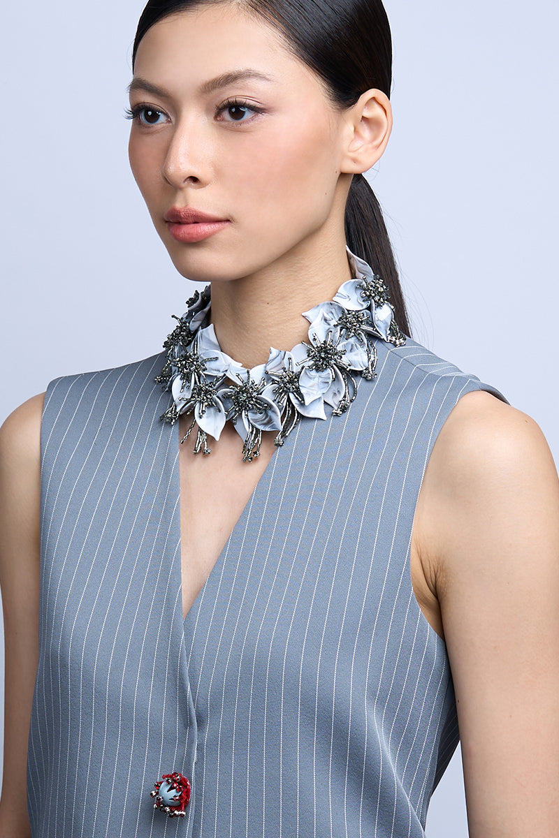 Aidan & Ice Flora Gray Necklace featuring a delicate floral pendant on a silver chain, stylish jewelry for everyday or special occasions.