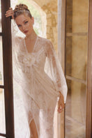 Arti Apparel Aura Maxi Dress displayed on a hanger, featuring flowing fabric and elegant design suitable for casual or formal occasions