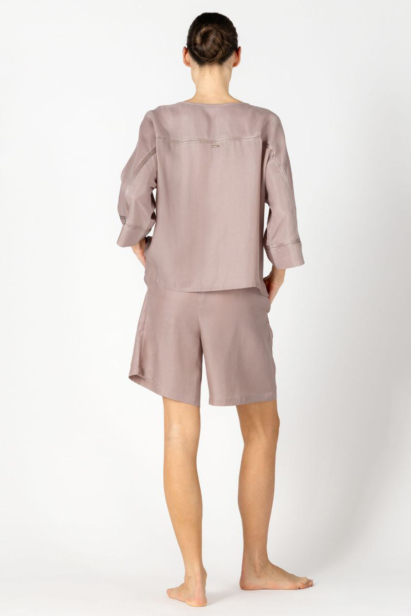 NK IMODE KACEY CITY shirt top in freckles, stylish loungewear with a relaxed fit and playful dotted pattern, shown on a model.