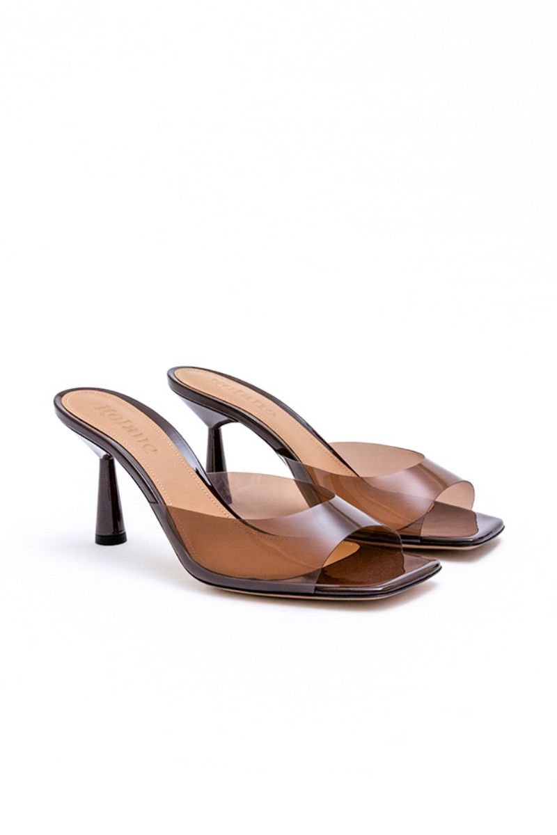 Kolane Greta mule sandals in chocolate brown with transparent accents, stylish slip-on footwear for casual and chic looks.