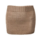 Rose gold sparkly knit mini skirt by Natalia Fedner, featuring shimmering fabric and a fitted, stylish silhouette.