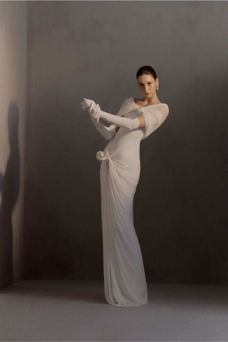 White Plan Francesca gown featuring elegant fabric and a flowing silhouette, perfect for formal occasions.