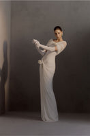 White Plan Francesca gown featuring elegant fabric and a flowing silhouette, perfect for formal occasions.