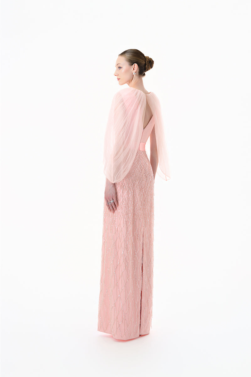 Blush pink beaded V-neck cape gown by Happy Clothing, featuring intricate beadwork and elegant flowing fabric.