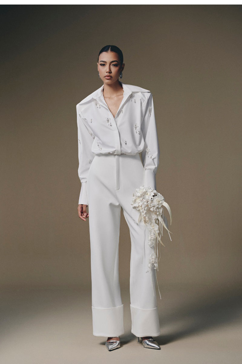 Beaded shirt by Keira Tong featuring intricate beadwork and a stylish design, shown on a model in a fashion photo.