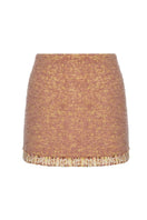 Lalo Rozany beige knitted mini skirt with a fitted waist and ribbed texture, shown on a mannequin.