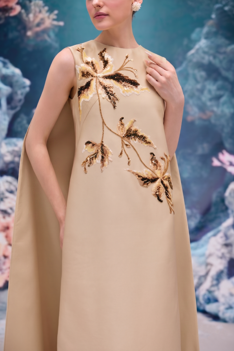 Beige Lysandra royal taffeta gown by 21Six featuring elegant draping and a flowing silhouette, perfect for formal occasions.