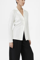 Dāl the Label modal rib knit collared cardigan displayed on a model, showcasing the soft fabric and classic button-up design.