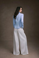 Keira Tong striped cupped collar shirt featuring a classic pattern, button front, and long sleeves, displayed on a hanger.