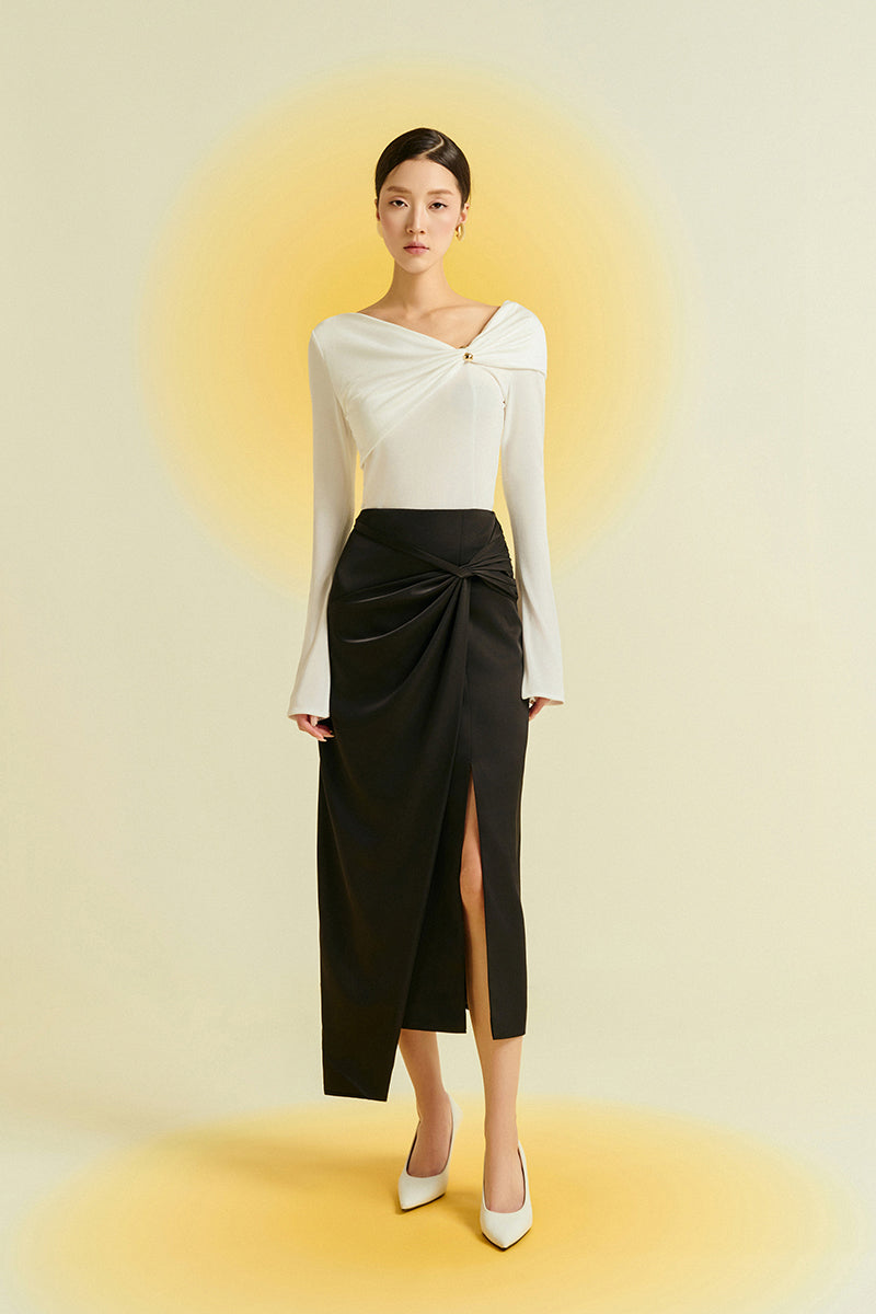 Black silk midi skirt from EEGEN STUDIO featuring a smooth, flowing fabric and a stylish, elegant design.