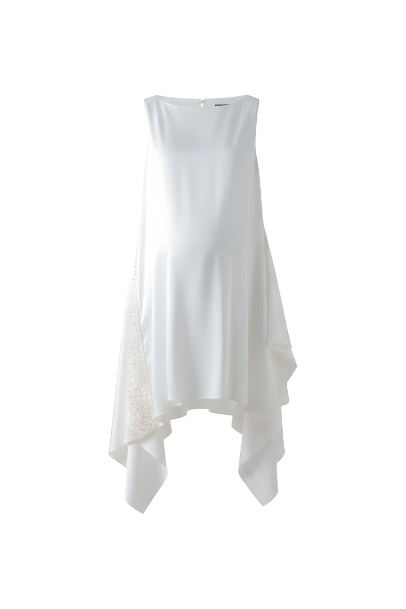 White silk tunic set from DOC BAN, featuring a stylish midi dress with a flowing silhouette and elegant design.