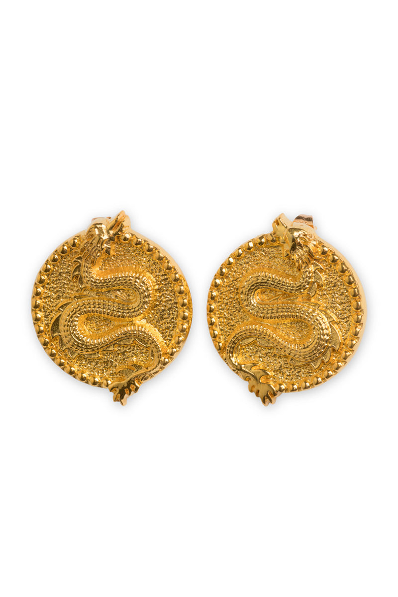 Natia x Lako dragon earrings with intricate metal design, hanging from hooks, detailed and stylish jewelry accessory