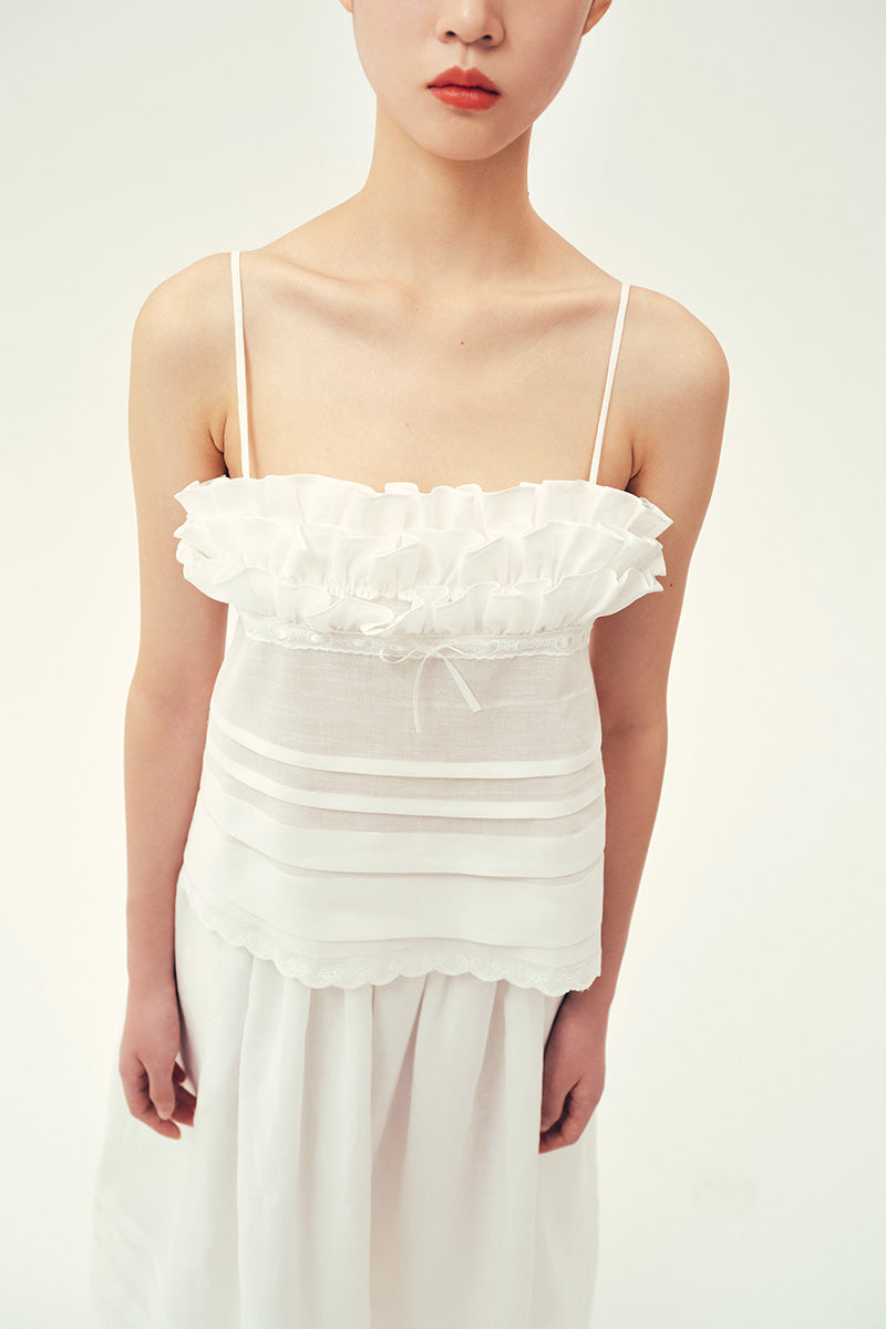 Chictopia ivory top with stylish neckline and soft fabric, perfect for casual or dressy outfits.