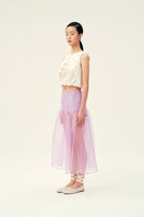 Chictopia Lois lilac midi skirt, flowy and stylish, with a high waist and pleated design, shown on a model.