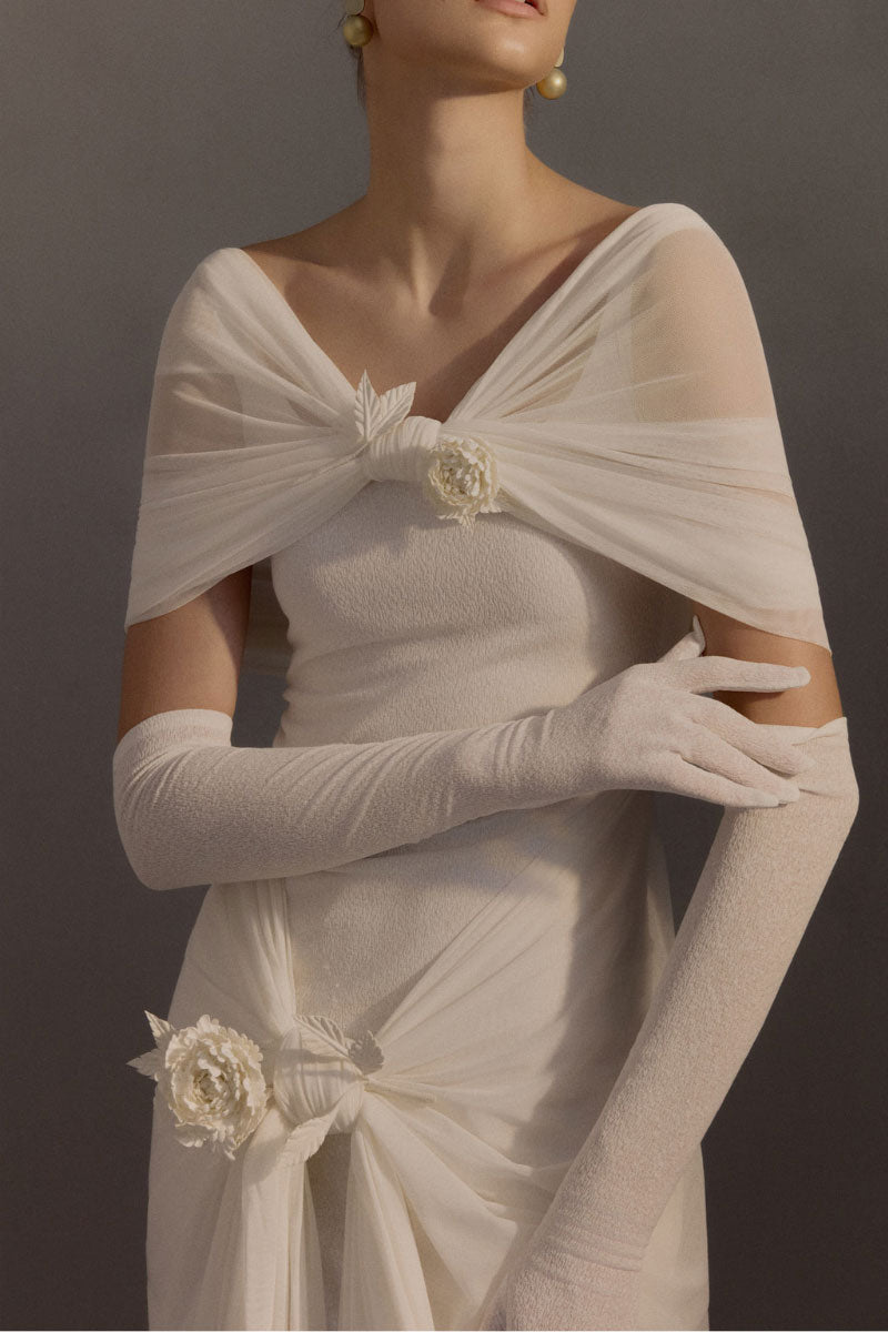 White Plan Francesca gown, elegant evening dress with flowing fabric and detailed design, perfect for formal occasions.