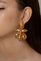 Gold Fiona Fire earrings by ANATINA featuring fiery, flame-shaped design in polished metal for a bold, stylish look.