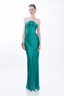 Elegant emerald green Kaya gown by LEDIEL, flowing fabric and intricate details, perfect for formal occasions.