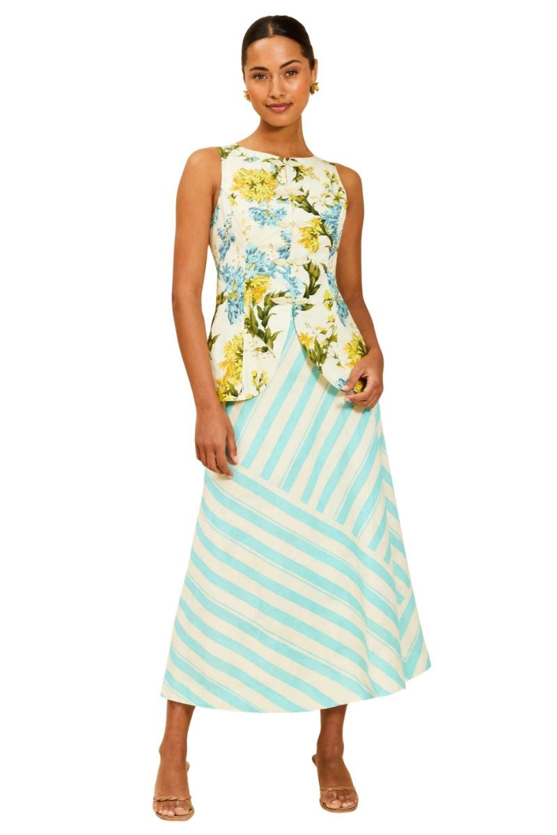 Mestiza New York Annelise vest in Verdant Blooms, green floral tops with a fitted silhouette, displayed on a hanger.