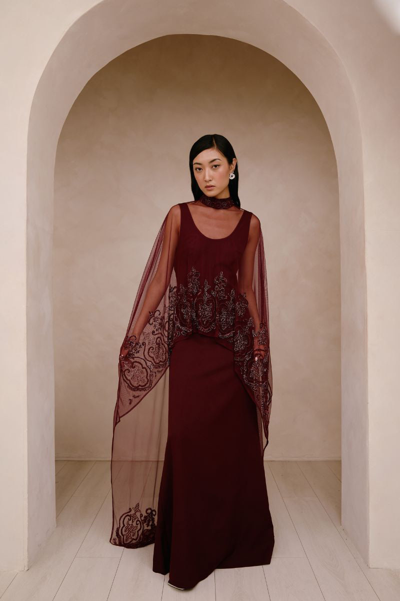 Elegant Raishma Aurelia gown with intricate lace details and flowing fabric, perfect for formal occasions.