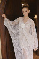 Arti Apparel Aura Maxi Dress displayed on a hanger, featuring flowing fabric and a feminine, elegant design.