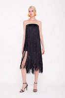 Black Valenciani all-over fringe midi dress showing flowing fabric and detailed fringe accents on the hem.