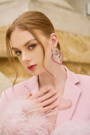 Baby pink Kelly taffeta feather suit co-ords by 21Six, featuring a jacket and pants set with feather details.