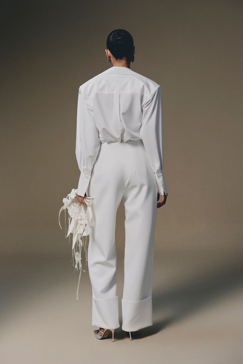 Keira Tong beaded shirt featuring intricate beadwork and stylish design, shown on a model in a close-up view.