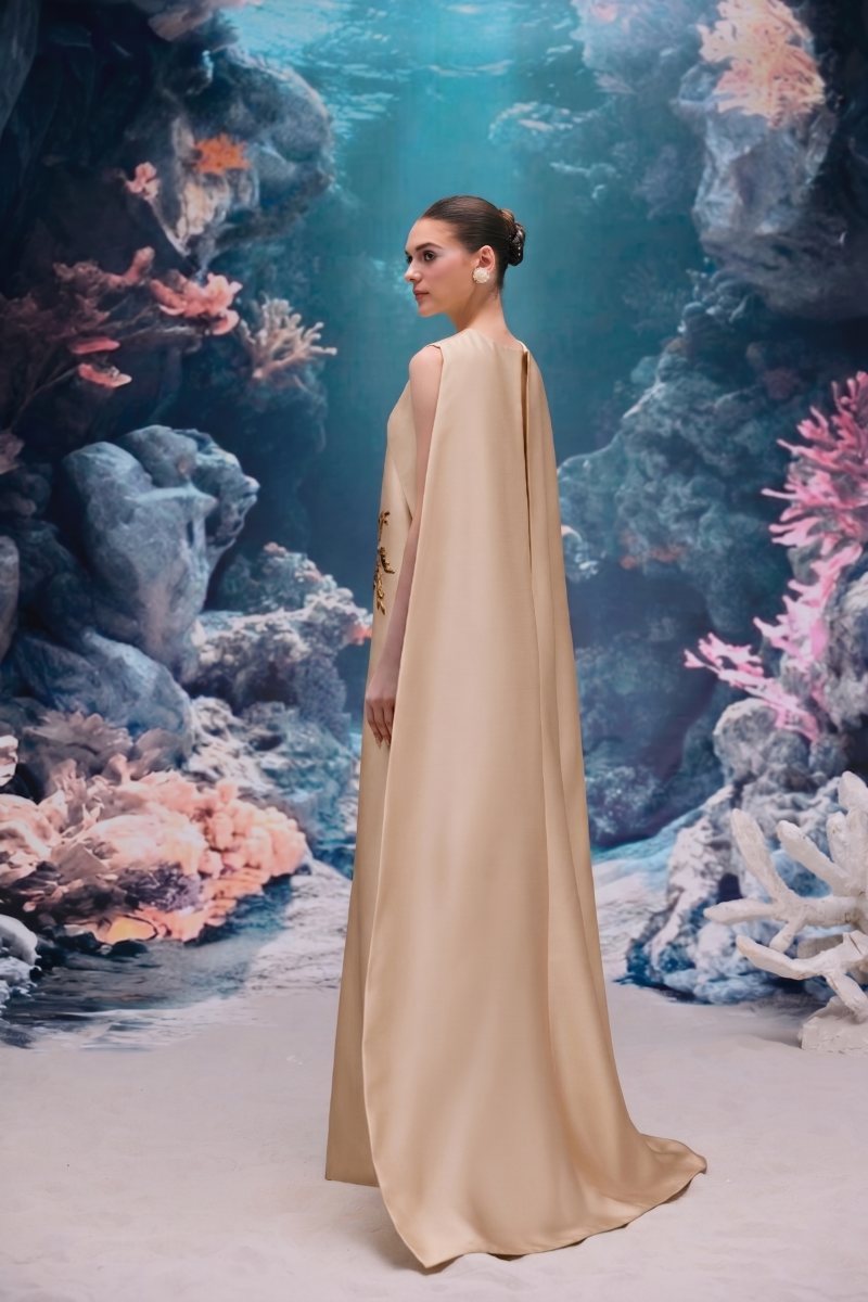 Beige Lysandra royal taffeta gown by 21Six, featuring elegant fabric and a flowing silhouette, ideal for formal occasions.