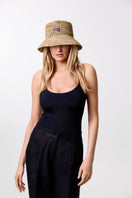 LE SH KA straw bucket hat from the VOL2 collection, featuring a wide brim and woven straw texture.