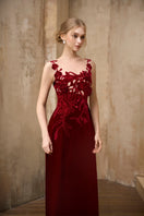 Elegant crimson velvet gown by Rosee de Matin featuring a flowing design and luxurious fabric.
