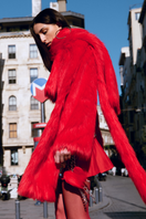 Sudi Etuz cropped faux fur coat with attached scarf detail, plush texture, and stylish design perfect for winter wear.