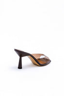 Kolane Greta mule sandals in chocolate brown with transparent straps, showcasing stylish open-toe design and slip-on style.