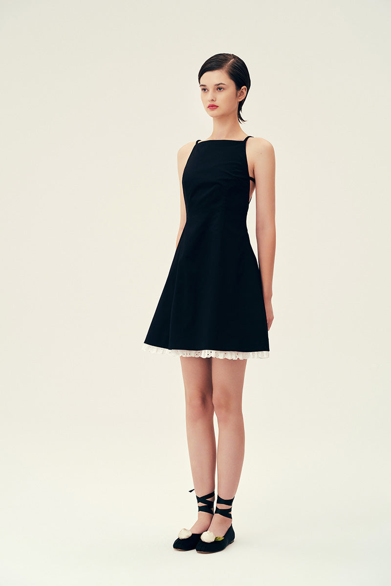 Black Linda mini dress by Chictopia, featuring a stylish fit and elegant design, shown on a model.