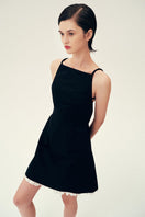 Black LINDA mini dress by Chictopia, featuring a stylish fit and elegant design, shown on a model in the image.