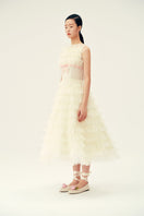Ivory Deborah midi dress by Chictopia displayed on a hanger, showcasing its elegant fabric and classic design.
