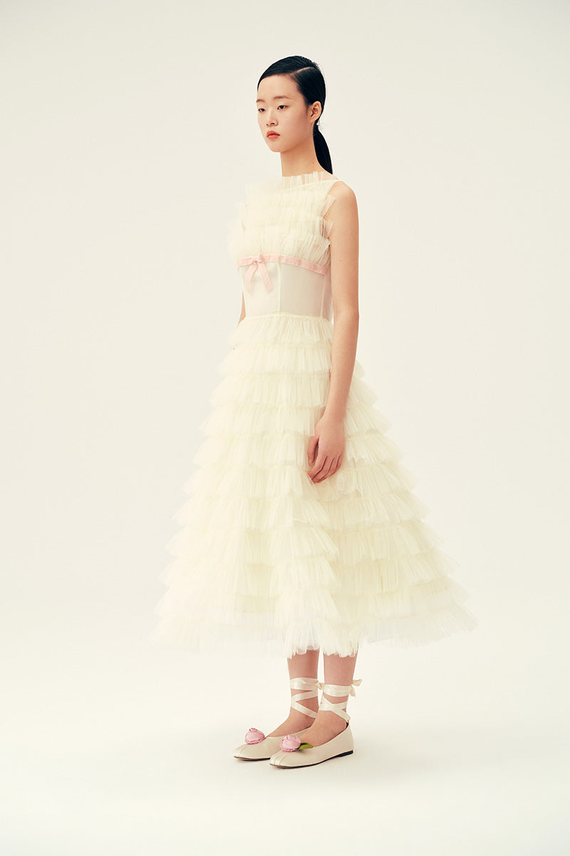 Ivory Deborah midi dress by Chictopia displayed on a hanger, showcasing its elegant fabric and classic design.