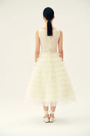 Chictopia ivory Deborah midi dress displayed on a hanger, featuring a flowy fabric and elegant design for stylish occasions.