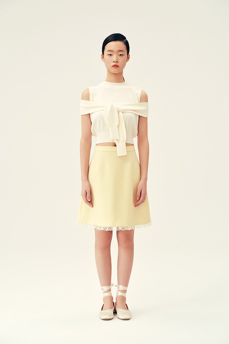 Cream Martha vest in Chictopia tops collection, featuring a stylish and versatile sleeveless design with a V-neck.