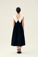 Chictopia Sydney black midi dress displayed on a model, featuring a fitted silhouette and elegant knee-length design.
