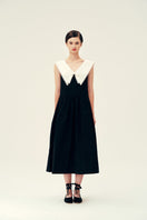 Chictopia Sydney black midi dress displayed on a hanger, showing its sleek, fitted design and stylish midi length.