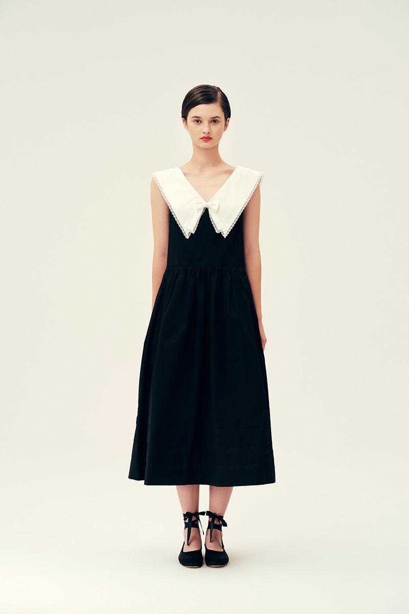 Chictopia Sydney black midi dress displayed on a hanger, showing its sleek, fitted design and stylish midi length.