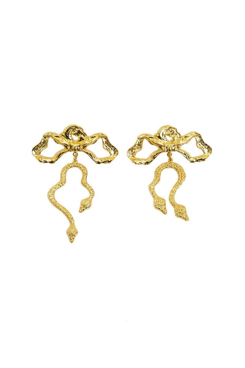 Natia x Lako bow earrings with asymmetric snake design, featuring elegant metal details for a stylish look