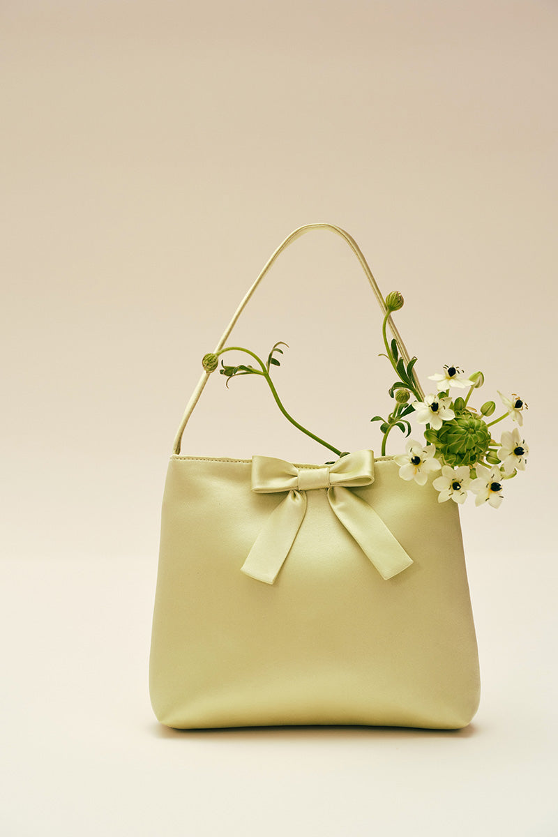 Mint Ribbon Bow Handbag by Chictopia, stylish top handle bag with a ribbon bow detail, perfect for elegant daytime wear.