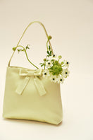Mint ribbon bow handbag with top handle, chic Chictopia brand, stylish accessory for fashionable outfits.