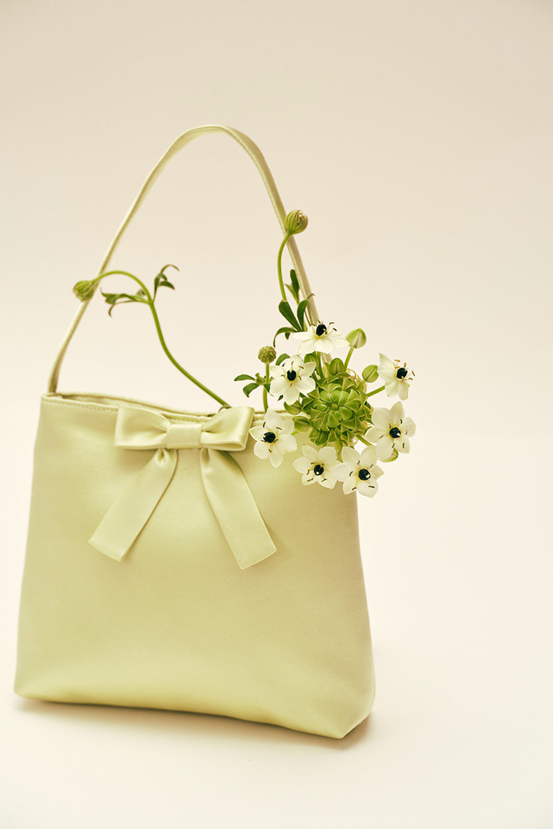 Mint ribbon bow handbag with top handle, chic Chictopia brand, stylish accessory for fashionable outfits.