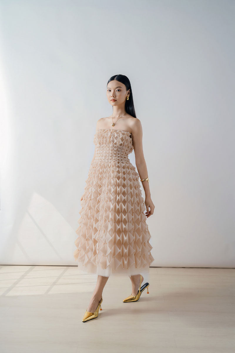 Nude Origami-Pleated Strapless Midi Dress by DOC BAN, showcasing elegant pleats and a sleek strapless design.