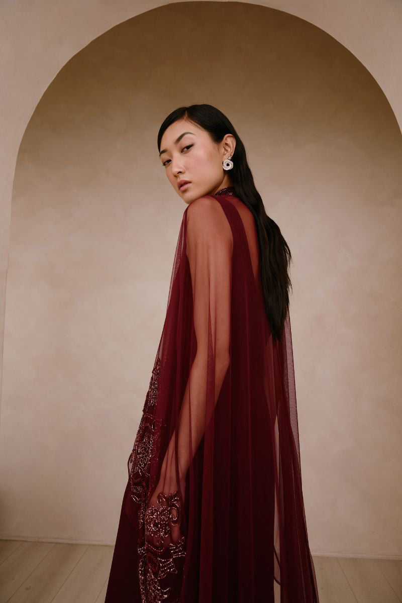 Elegant AURELIA gown by Raishma featuring intricate lace and flowing fabric, displayed on a mannequin.